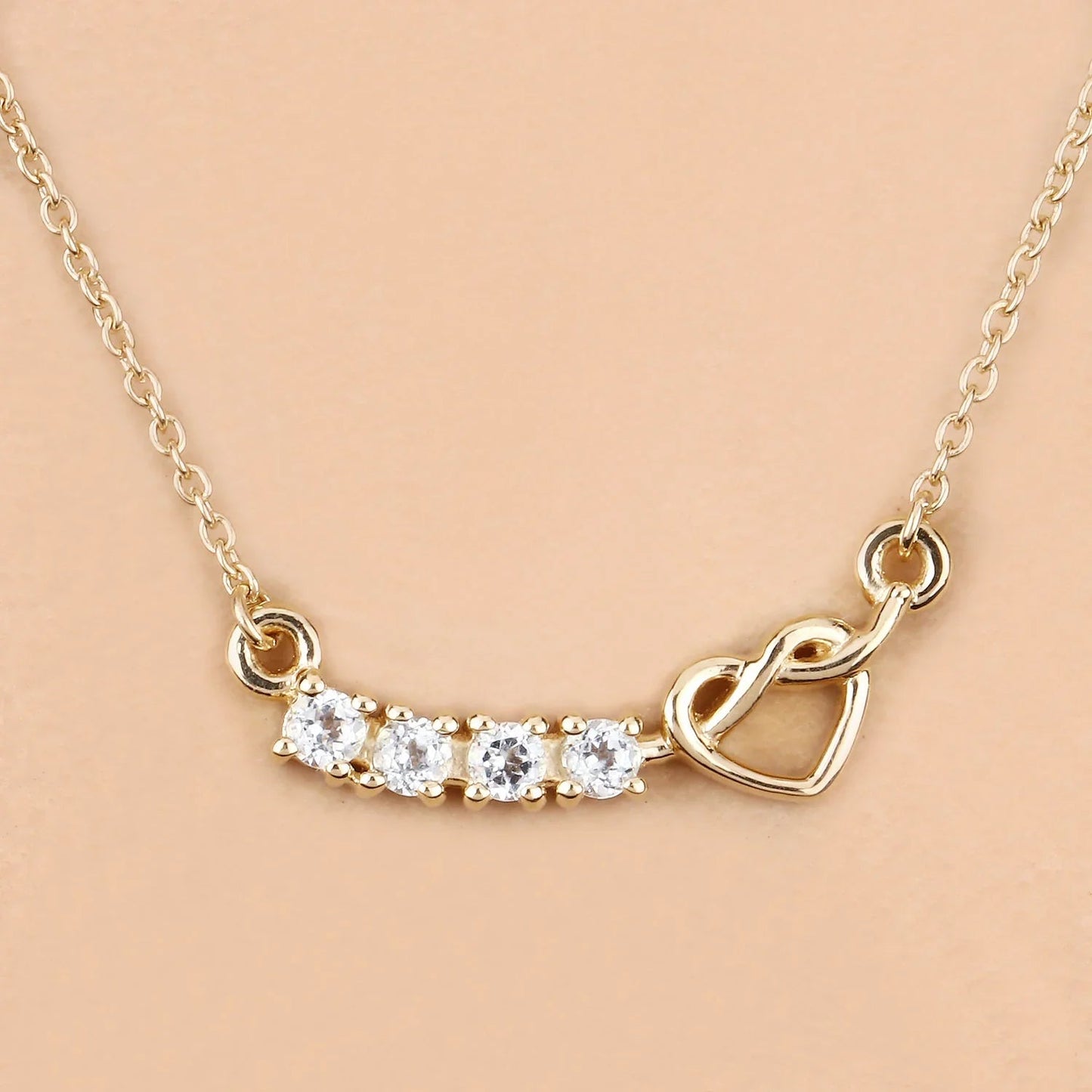 0.30 Ct Round Blue Topaz Prong 18K Gold Plated Silver Heart & Infinity Necklace