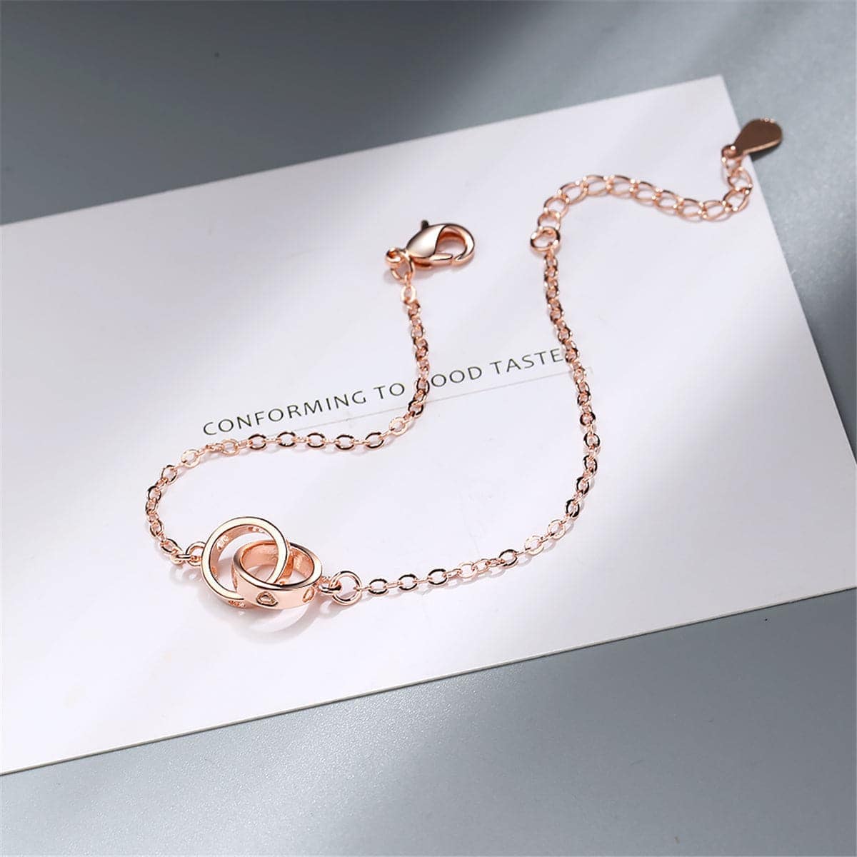 Rose Goldtone Double-Crossing Ring Charm Bracelet