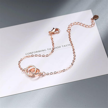 Rose Goldtone Double-Crossing Ring Charm Bracelet