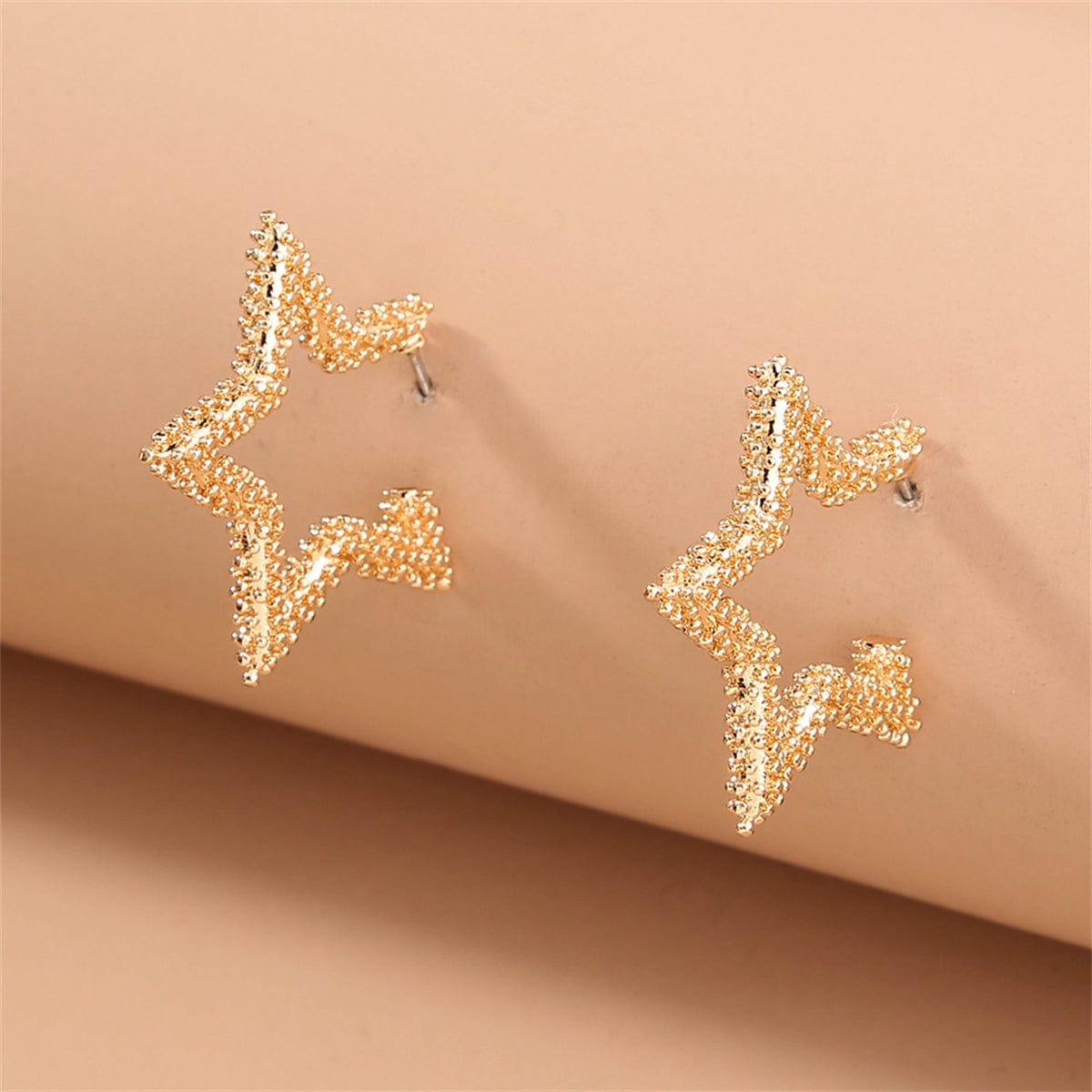 Goldtone Open Star Huggie Earrings