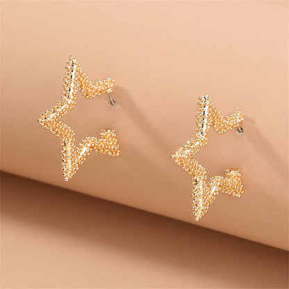 Goldtone Open Star Huggie Earrings