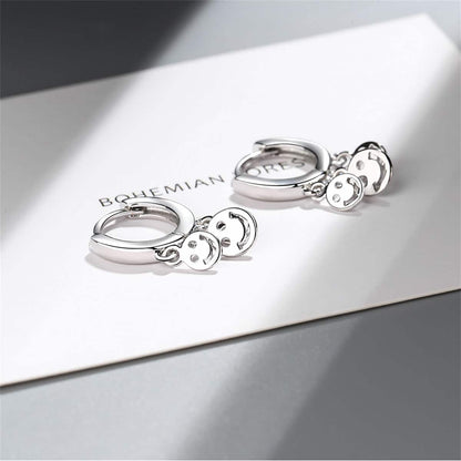 Silvertone Smiley Tassel Huggie Earrings