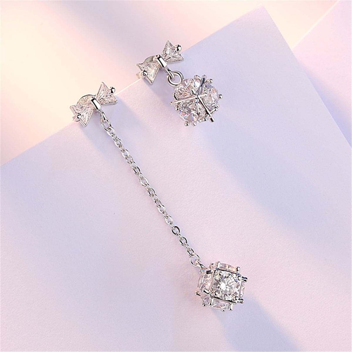 Cubic Zirconia & Silvertone Bow Asymmetrical Drop Earrings