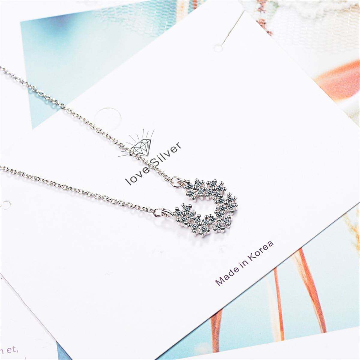 Cubic Zirconia & Silvertone Linking Flower Pendant Necklace