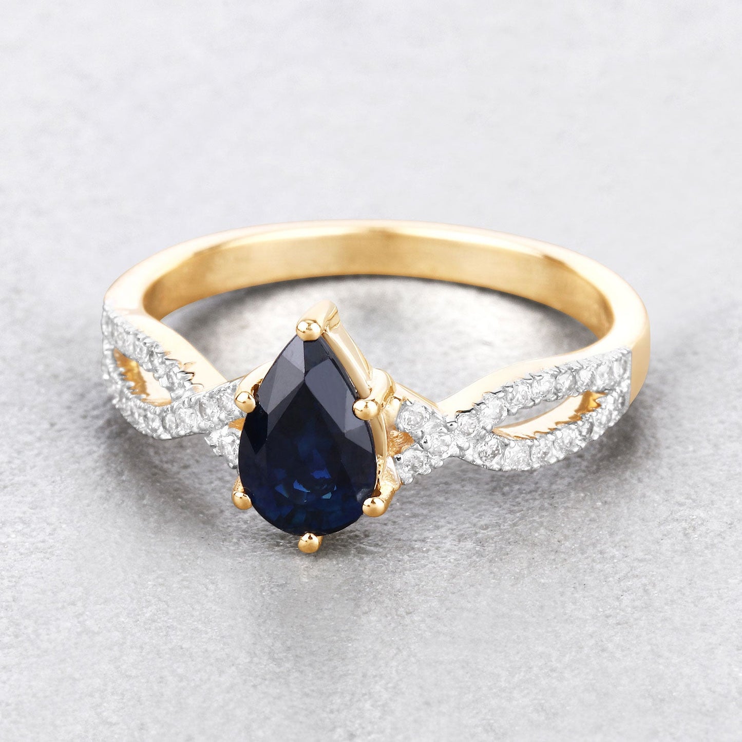 1.14ct Pear Blue Sapphire and Diamond Prong 14K Yellow Gold Crossover Engagement Ring