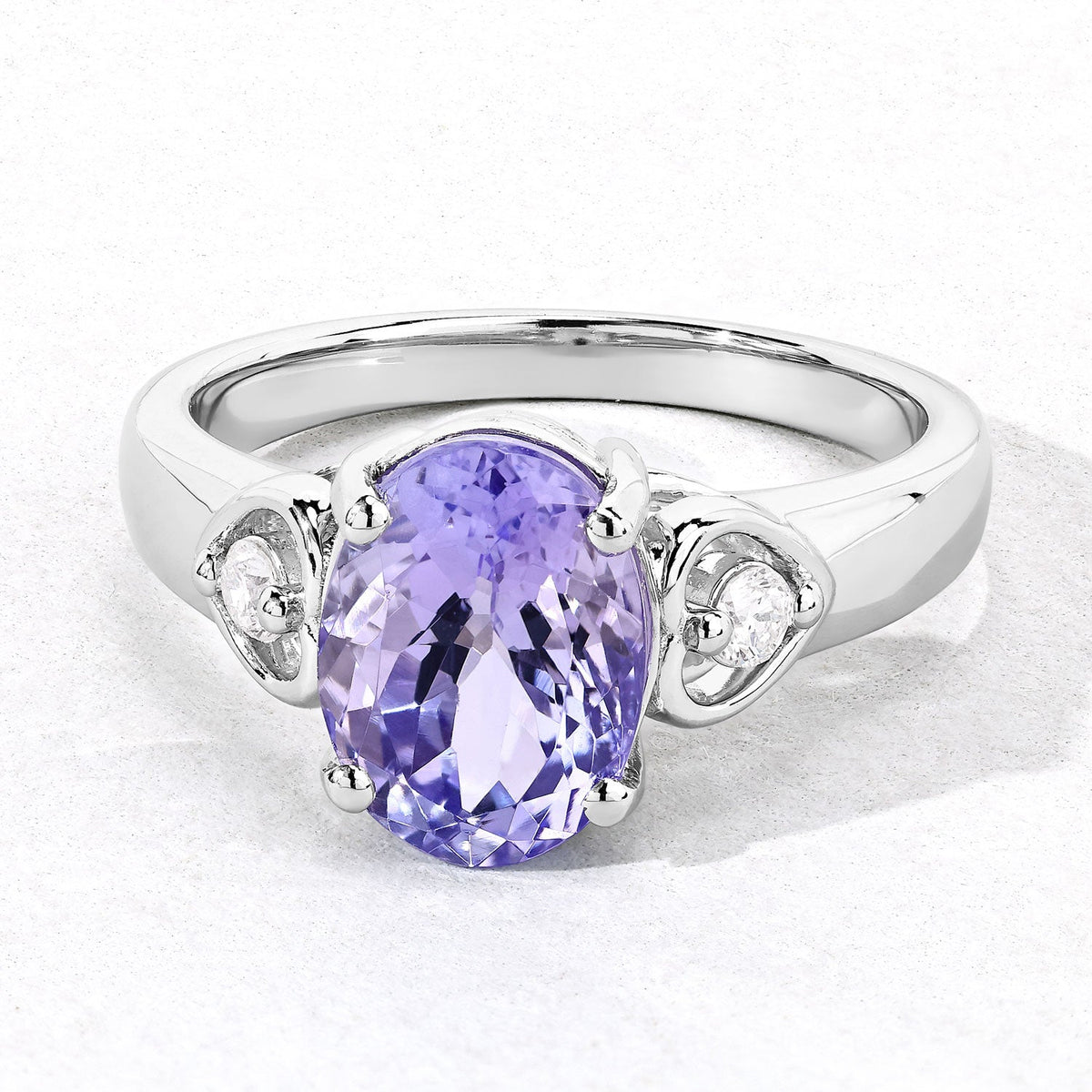 3.23 Cttw Oval Violet Tanzanite and Lab Diamond Rhodium over Silver 3-Stone Ring