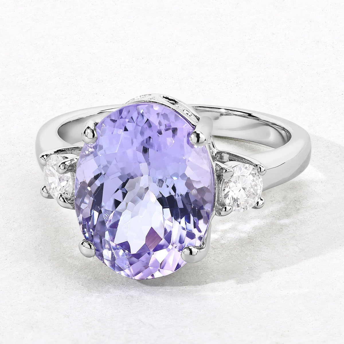 4.34 Cttw Oval Violet Tanzanite and Lab Diamond Rhodium over Silver 3-Stone Ring