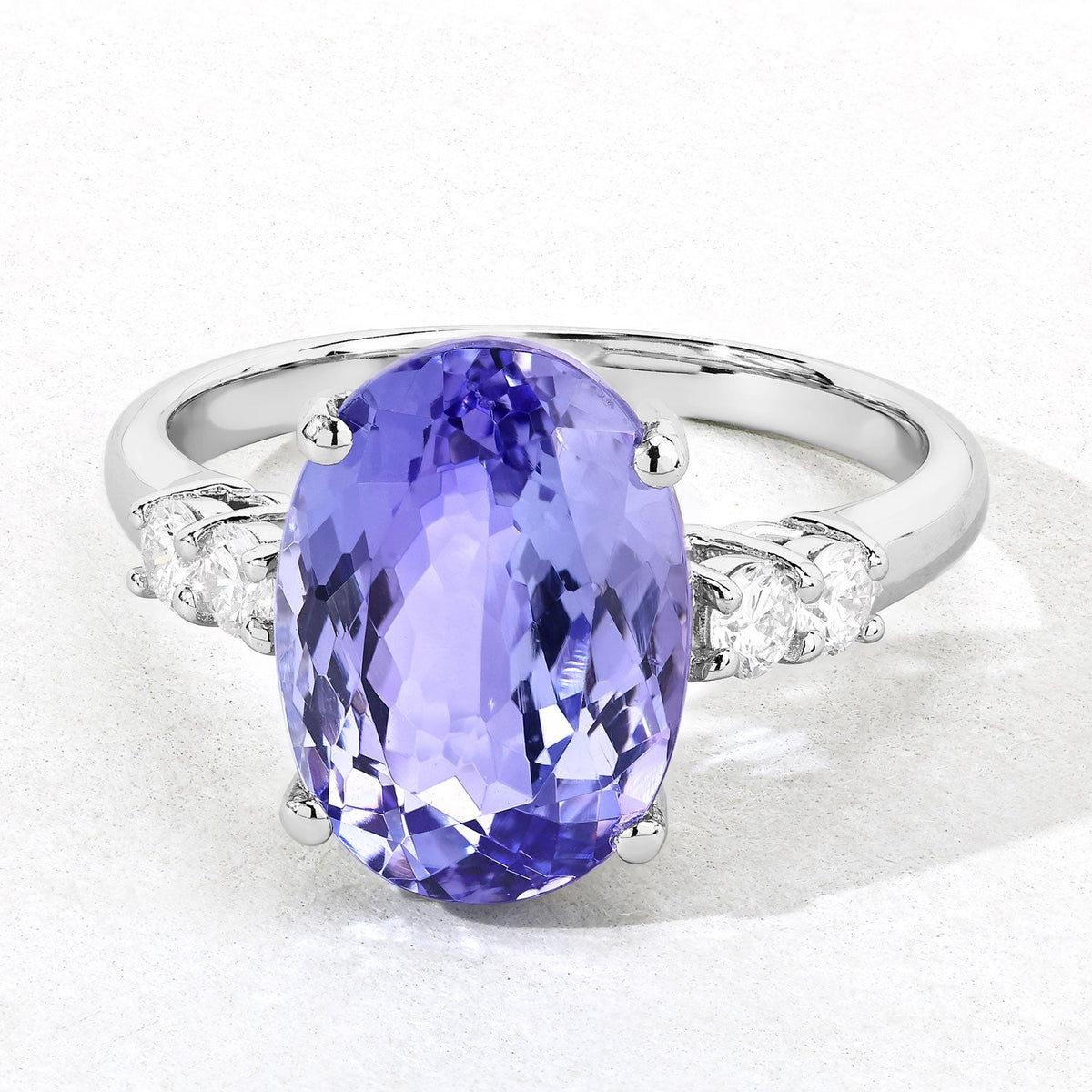 5.47 Cttw Oval Violet Tanzanite Lab Diamond Rhodium over Silver Five Stone Ring