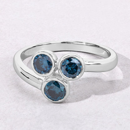 0.75 Cttw Round Teal Blue Diamond Bezel Rhodium Plated Silver Three Stone Bypass Ring