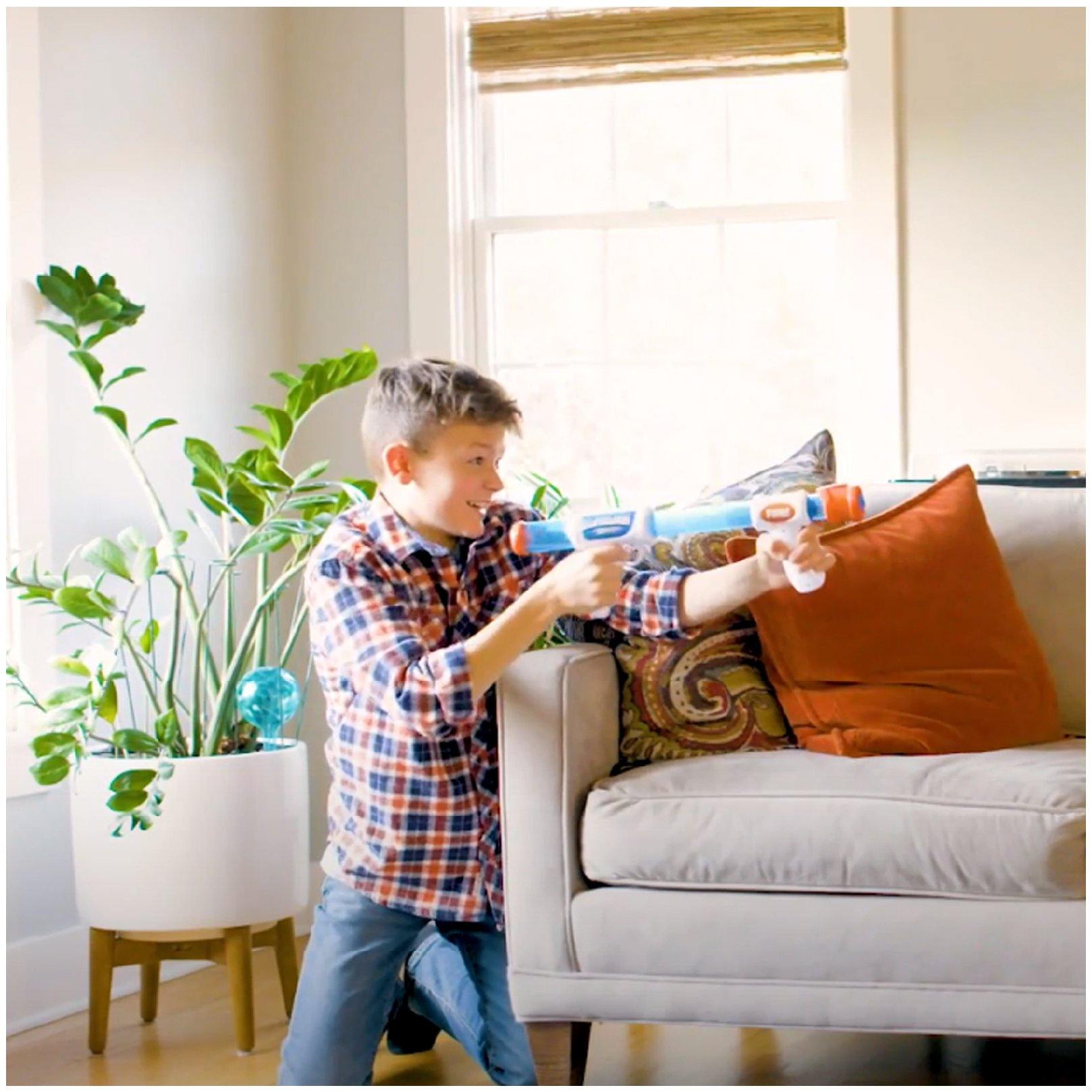White, blue dart gun and green, blue balls-