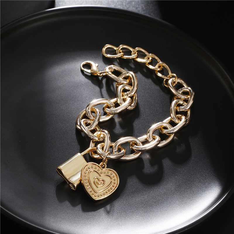 Goldtone Heart & Lock Link Charm Bracelet