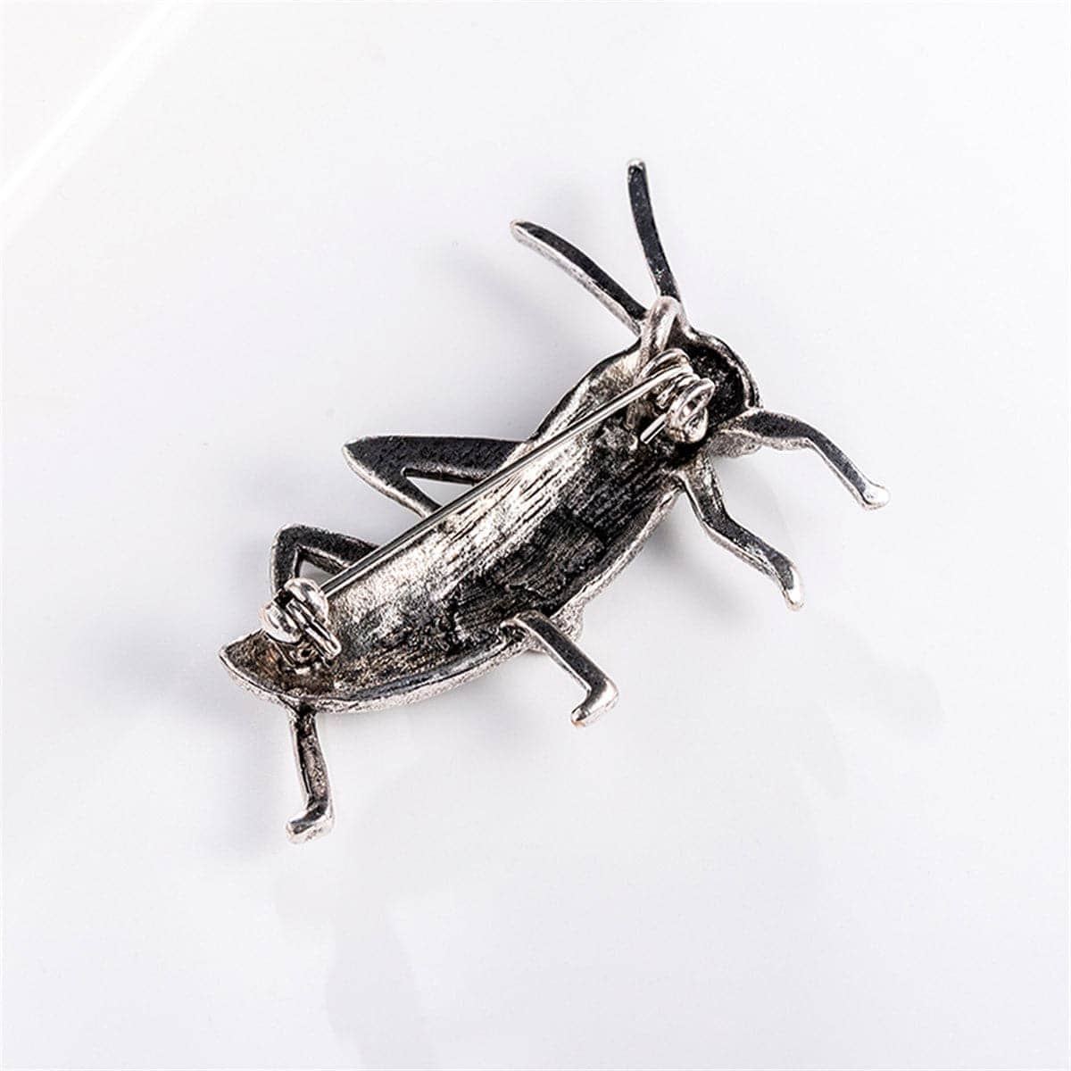Cubic Zirconia & Silvertone Locust Brooch
