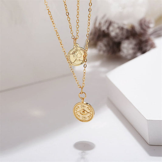 Goldtone Eye Coin Layered Pendant Necklace