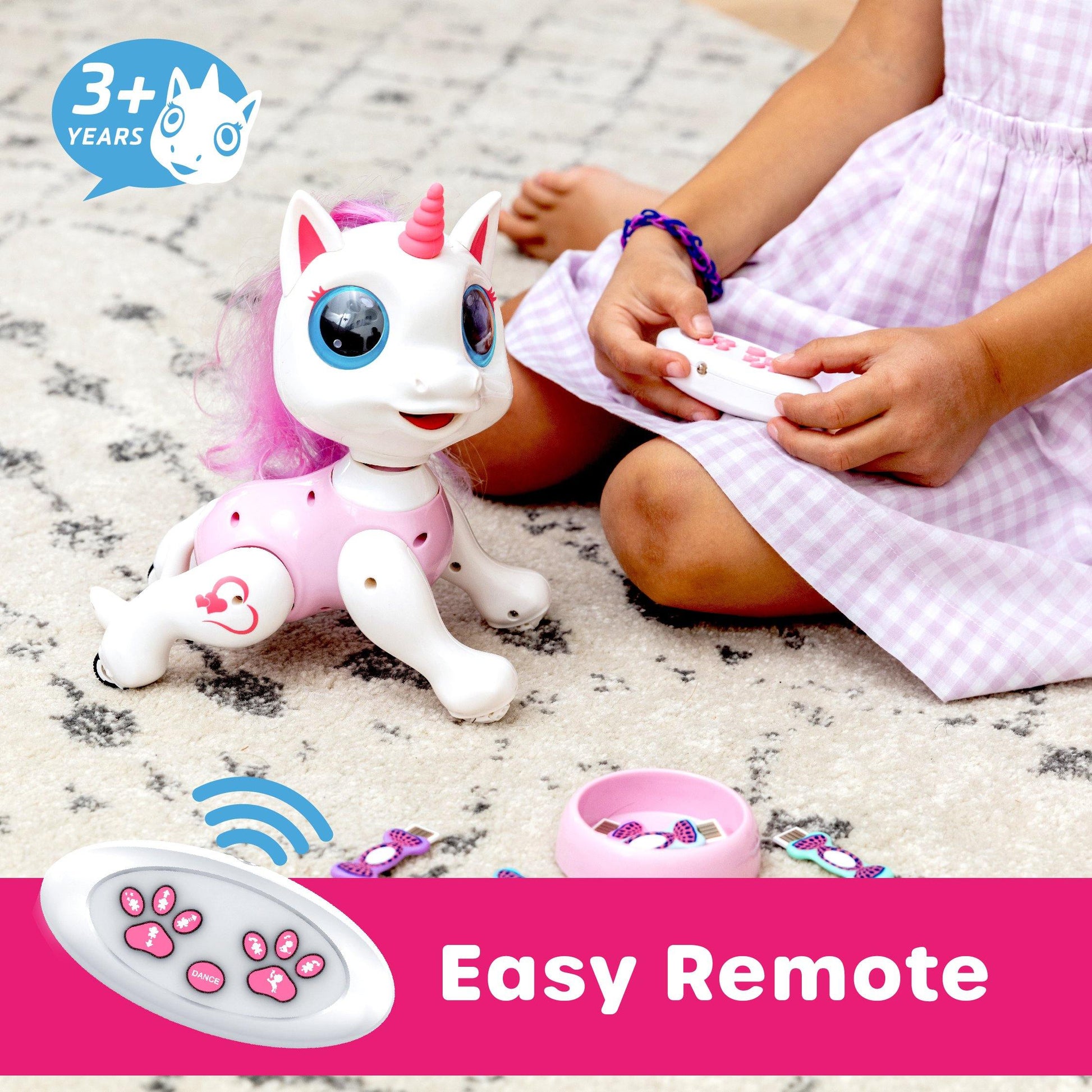 Pink/White robot unicorn, white remote, and , pink and black food-