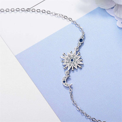 Blue Crystal & Silvertone Star & Moon Bracelet