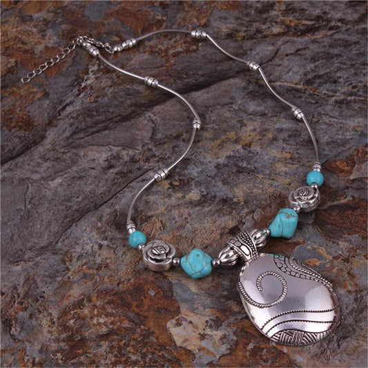 Turquoise & Silvertone Floral Teardrop Necklace
