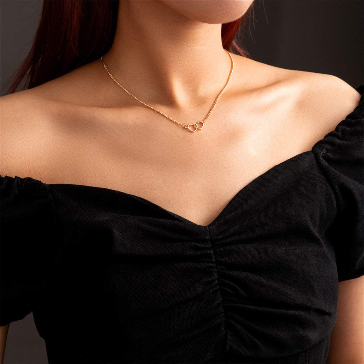 Goldtone Interlocked Heart Pendant Necklace