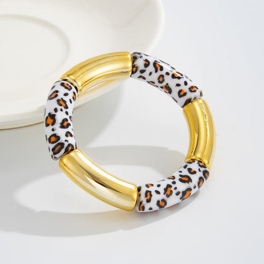 White Resin & Goldtone Cow Print Joint Stretch Bracelet